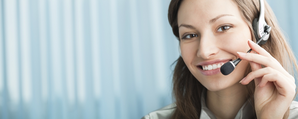 Female callcenter employee using headphone.jpg